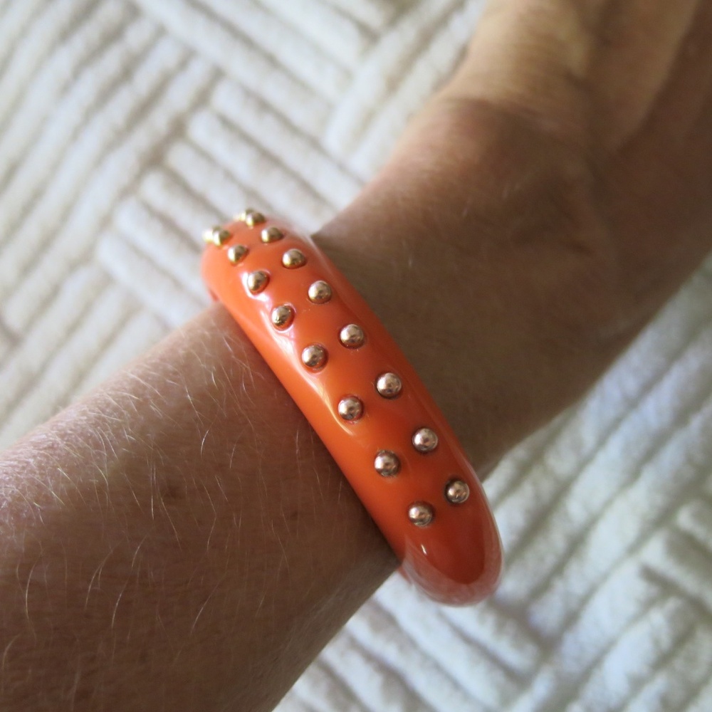 Kenneth Jay Lane vintage orange/coral lucite bangle with gold-colored studs